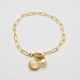Goldene Armkette mit Muschel und Perle